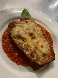 Sorrento's Restaurant signature dishes Thin Crust PizzaEggplant ParmesanAntipasto Salad